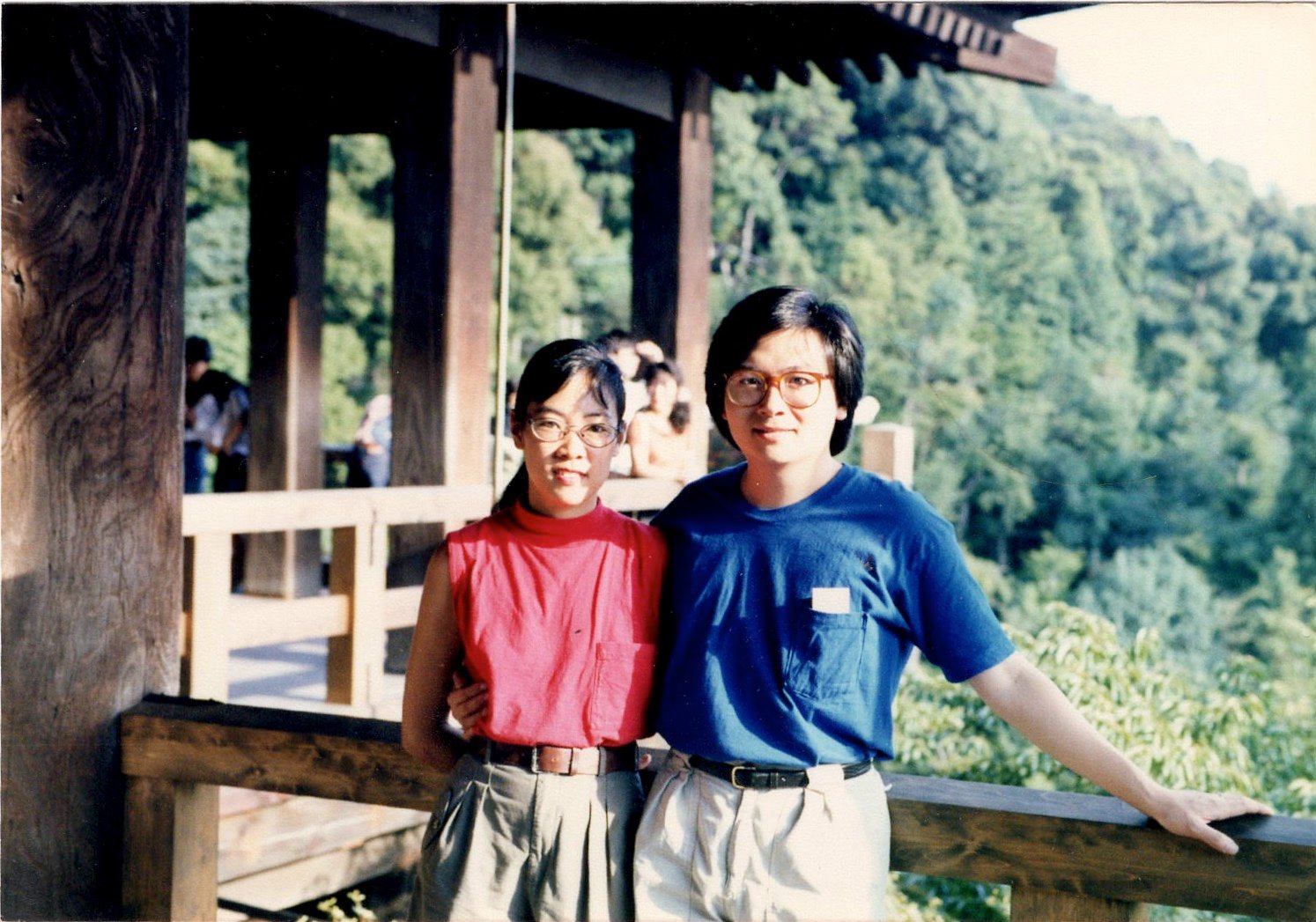 2004 Carole in red tank top and khaki shorts with late husband George in blue shirt and khaki pants in Kyoto, Japan.
